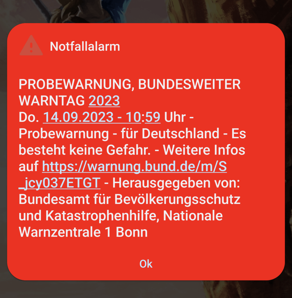 Das Bild zeigt ein Handydisplay mit der Meldung zum bundesweiten Warntag 2023.